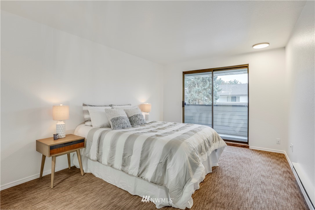 4114 Northeast 5th Street Renton, WA 98059 - Photo 12 of 20 a bedroom with a bed and a window