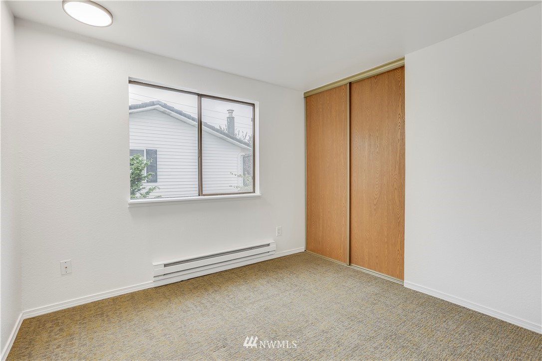 4114 Northeast 5th Street Renton, WA 98059 - Photo 14 of 20 an empty room with windows and closet