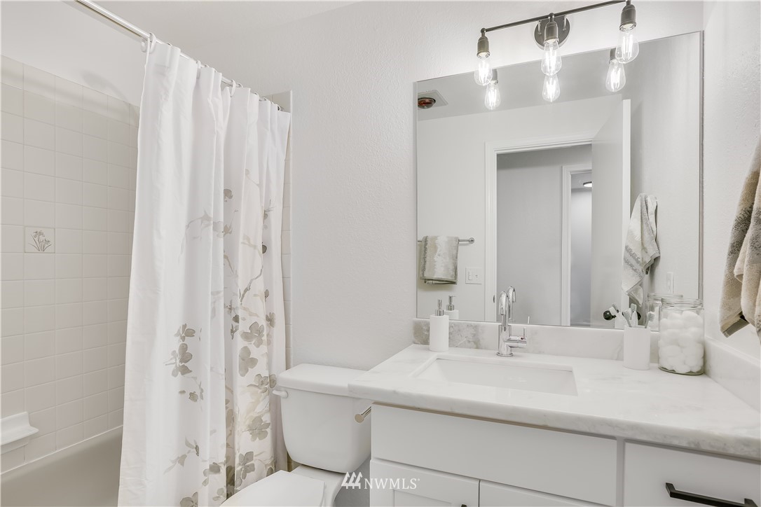 4114 Northeast 5th Street Renton, WA 98059 - Photo 16 of 20 a bathroom with a sink and a mirror