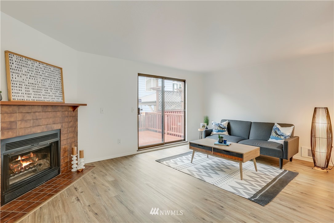 4114 Northeast 5th Street Renton, WA 98059 - Photo 5 of 20 a living room with furniture and a fireplace