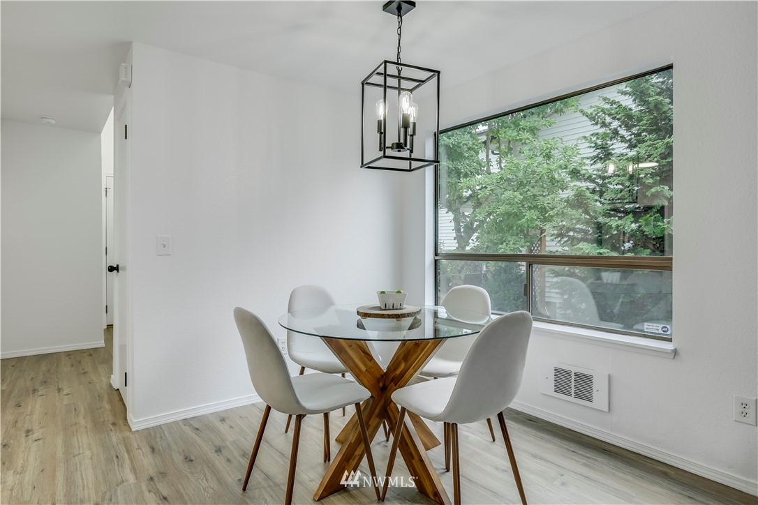 4114 Northeast 5th Street Renton, WA 98059 - Photo 8 of 20 a dining room with furniture window wooden floor