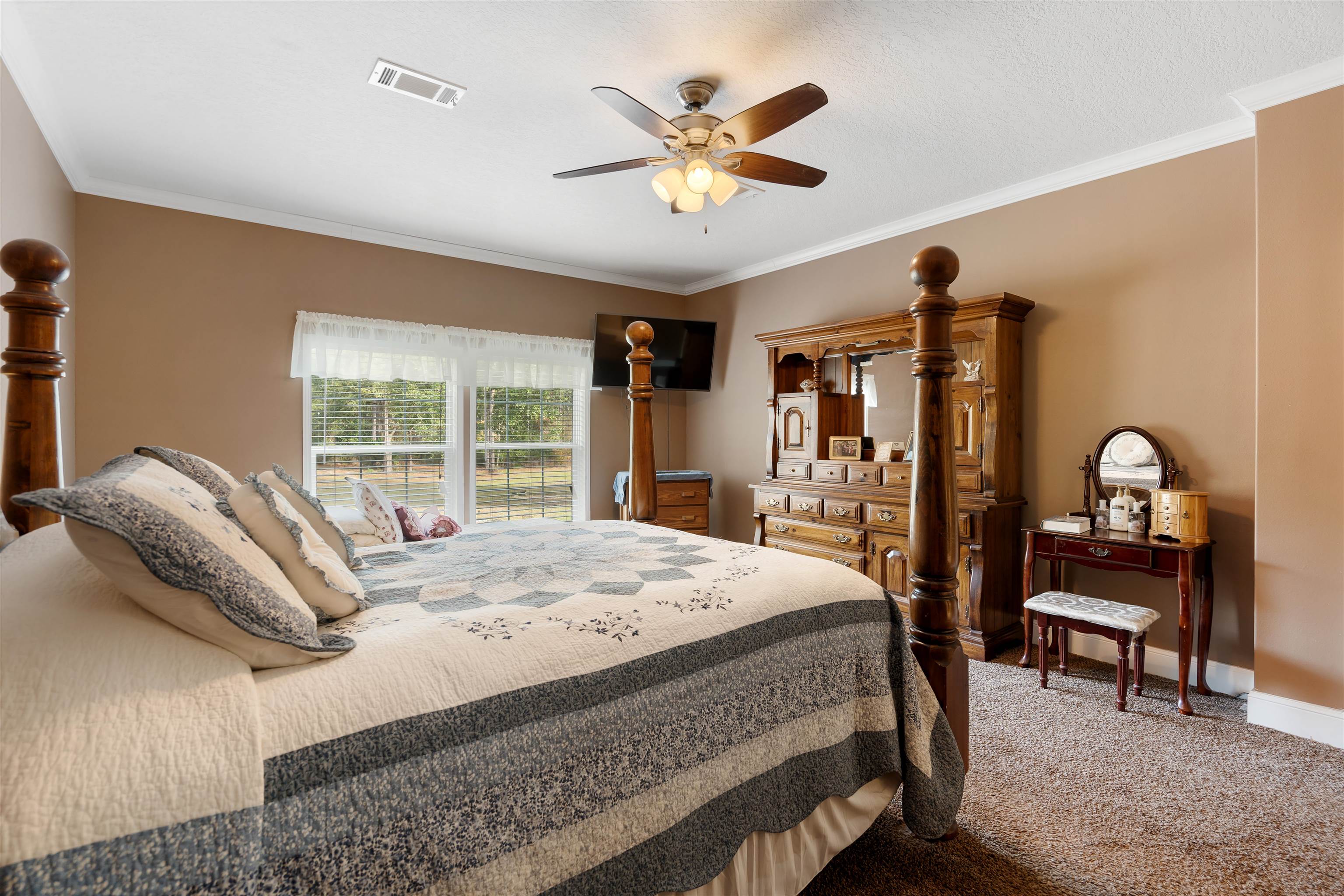 3000 Lightsey Road St. Augustine, FL 32084 - Photo 12 of 35 a bed sitting in a spacious bedroom next to a window