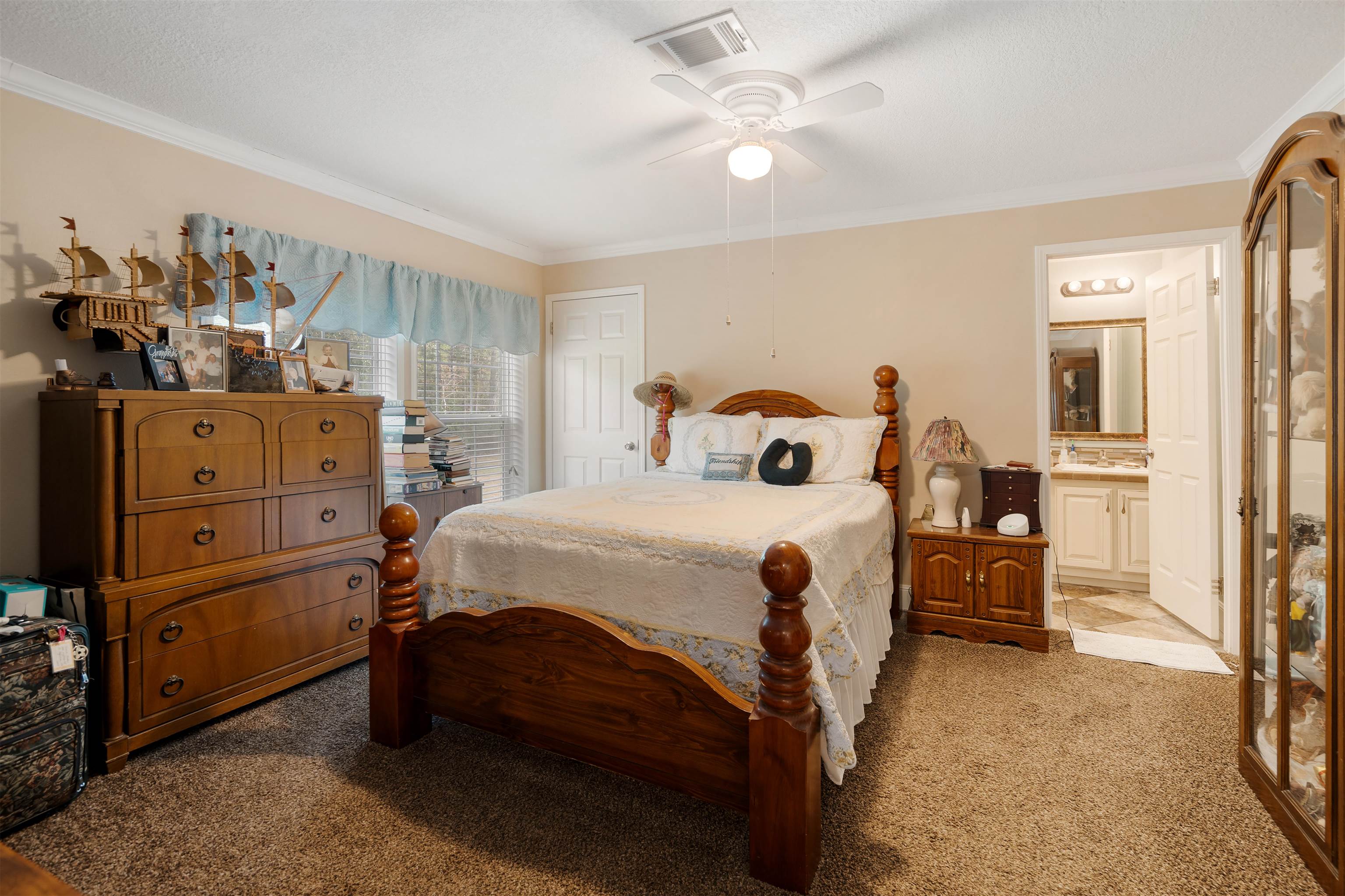 3000 Lightsey Road St. Augustine, FL 32084 - Photo 17 of 35 a bedroom with a bed and a chandelier