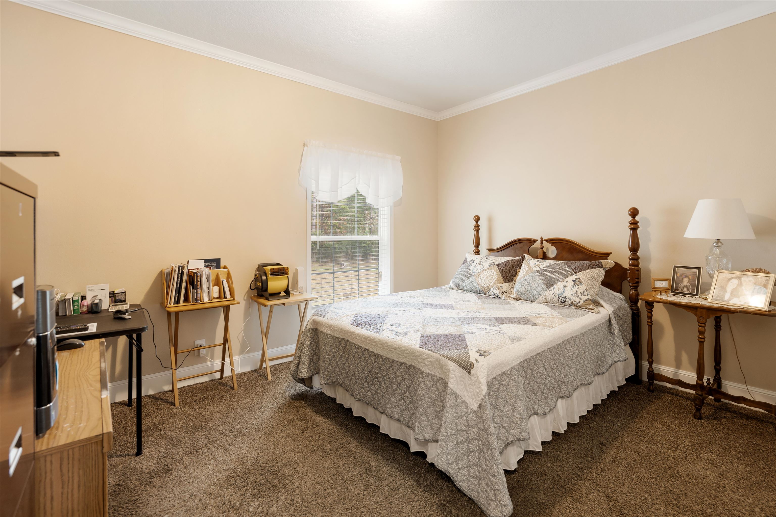 3000 Lightsey Road St. Augustine, FL 32084 - Photo 19 of 35 a large bed sitting in a bedroom next to a window