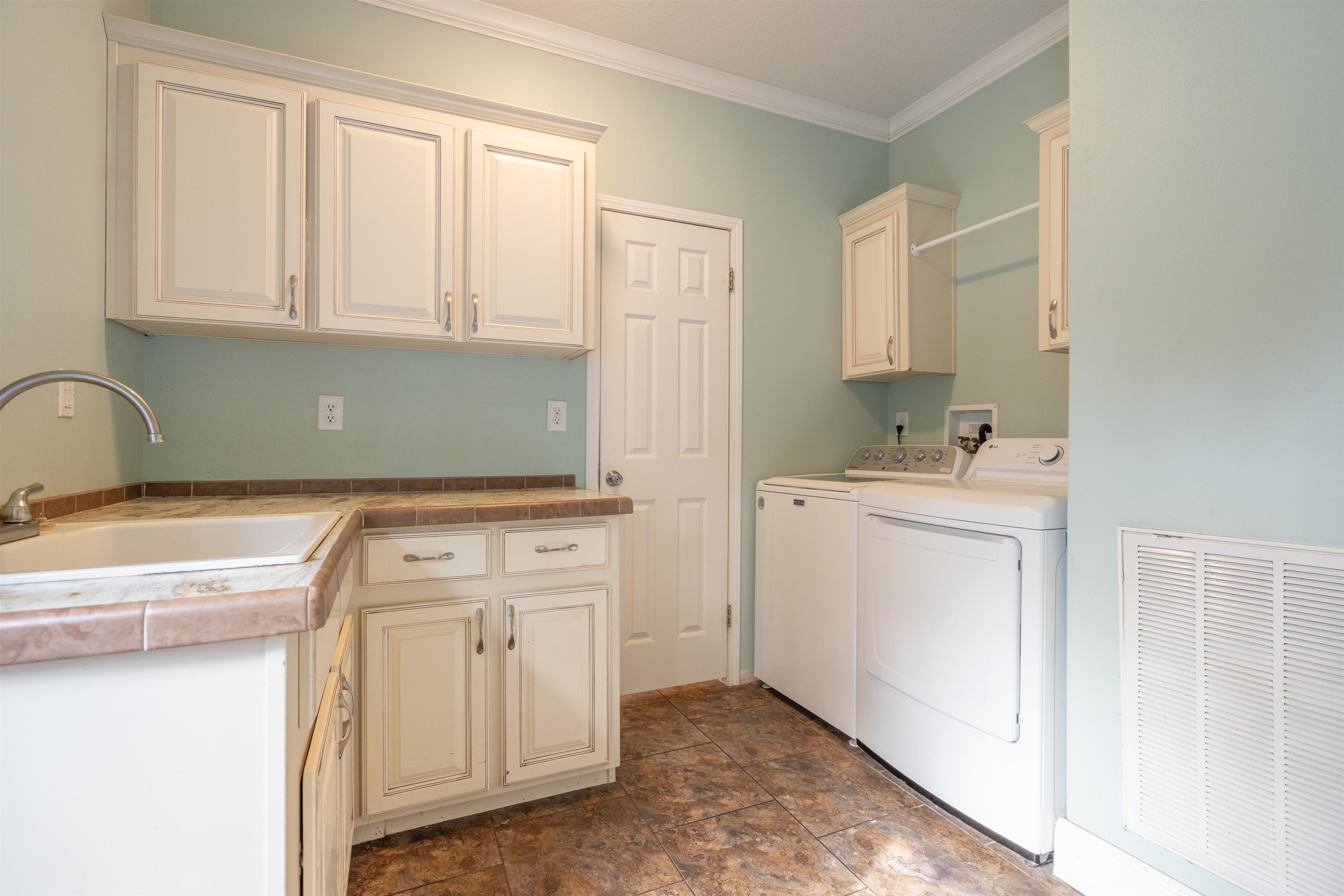 3000 Lightsey Road St. Augustine, FL 32084 - Photo 22 of 35 a utility room with a sink washer and dryer