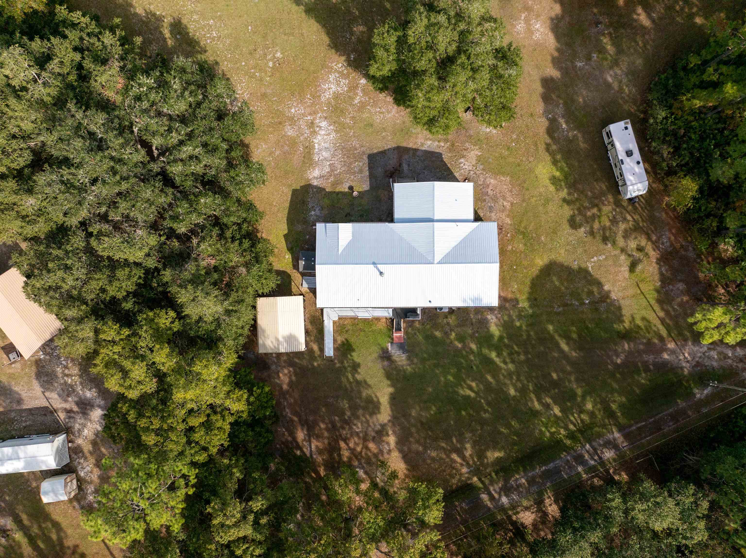 3000 Lightsey Road St. Augustine, FL 32084 - Photo 24 of 35 a view of a house with a yard and large tree