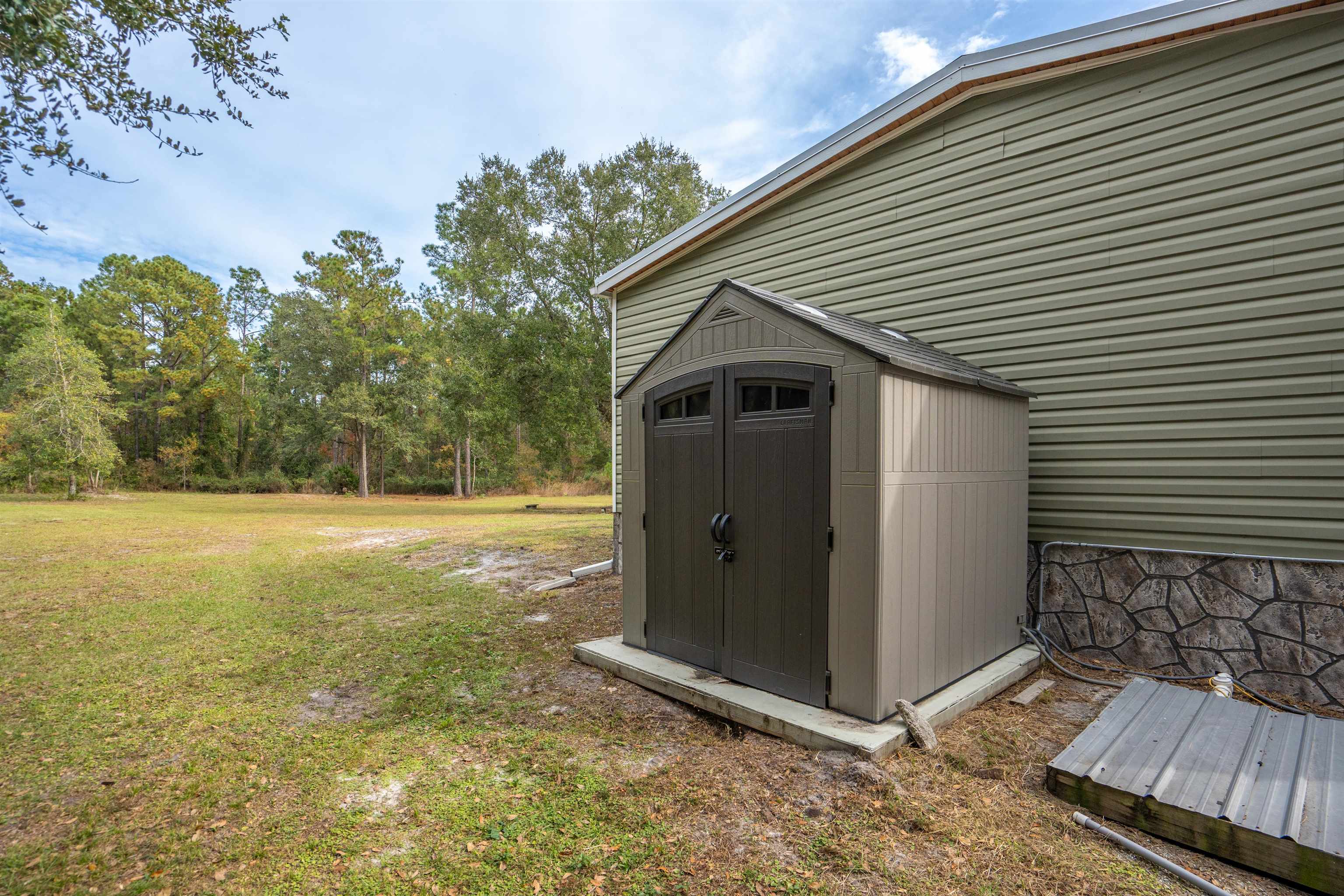 3000 Lightsey Road St. Augustine, FL 32084 - Photo 27 of 35 a view of backyard with large tree