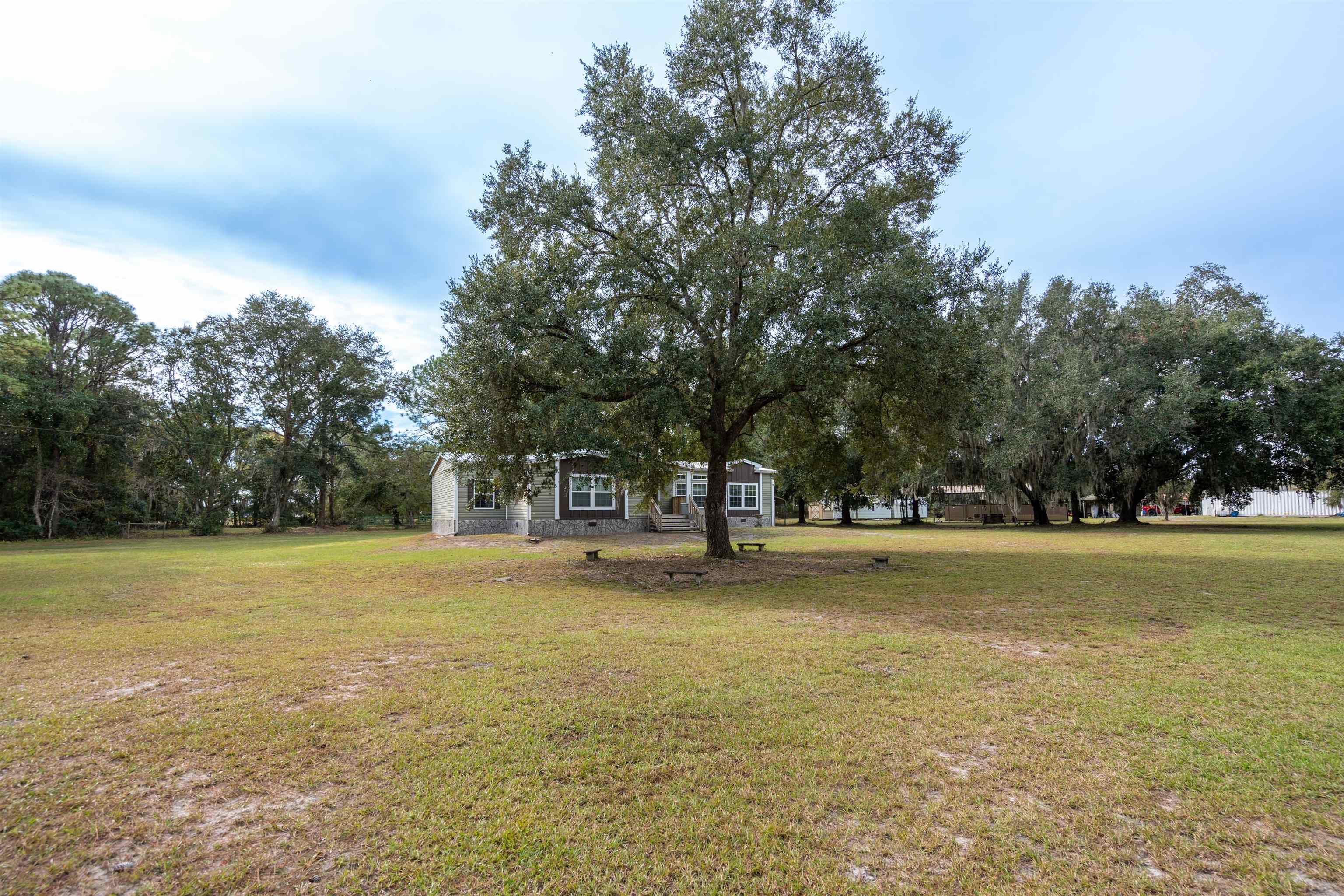 3000 Lightsey Road St. Augustine, FL 32084 - Photo 31 of 35 a view of a field with an trees in the background
