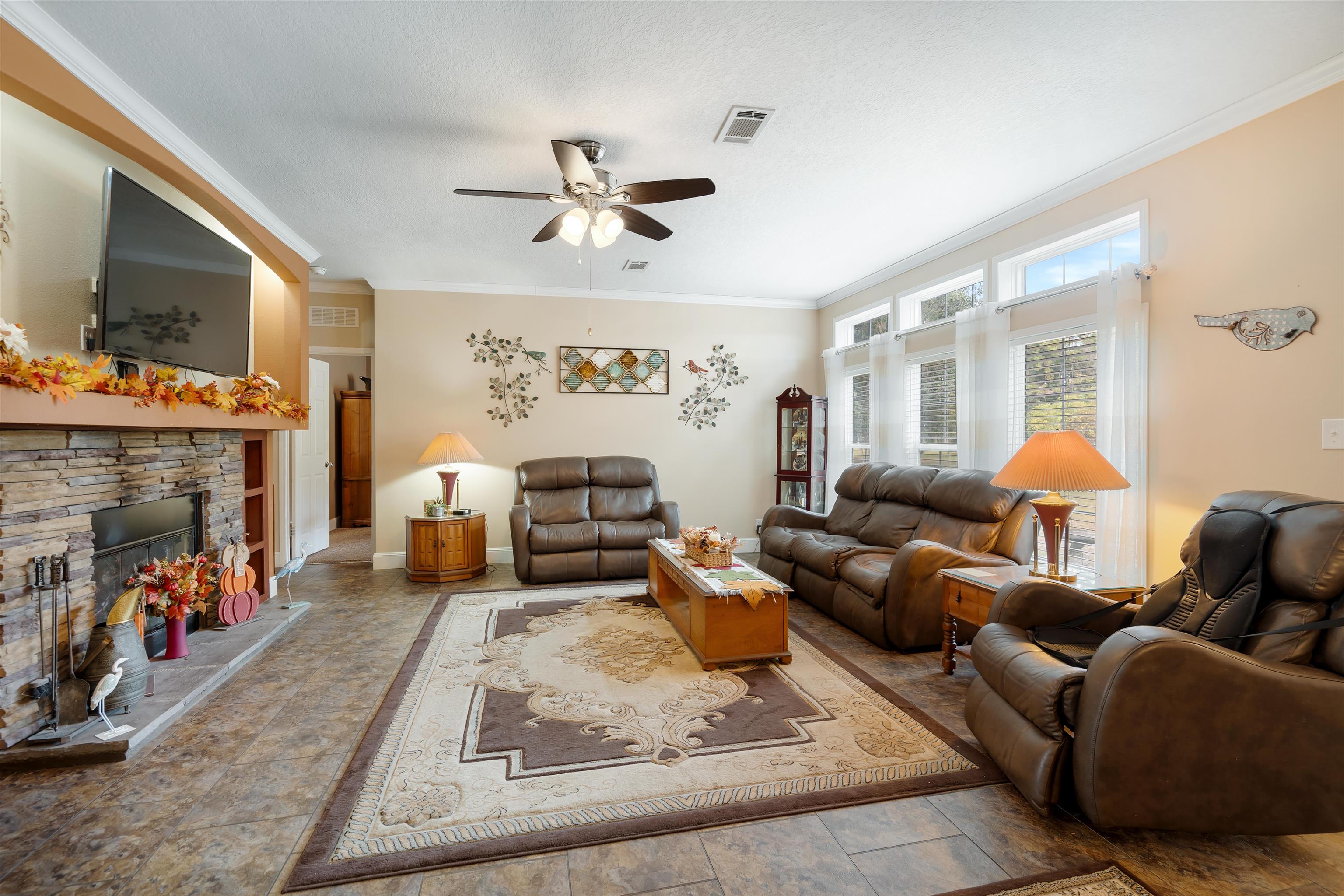 3000 Lightsey Road St. Augustine, FL 32084 - Photo 4 of 35 a living room with furniture and a fireplace