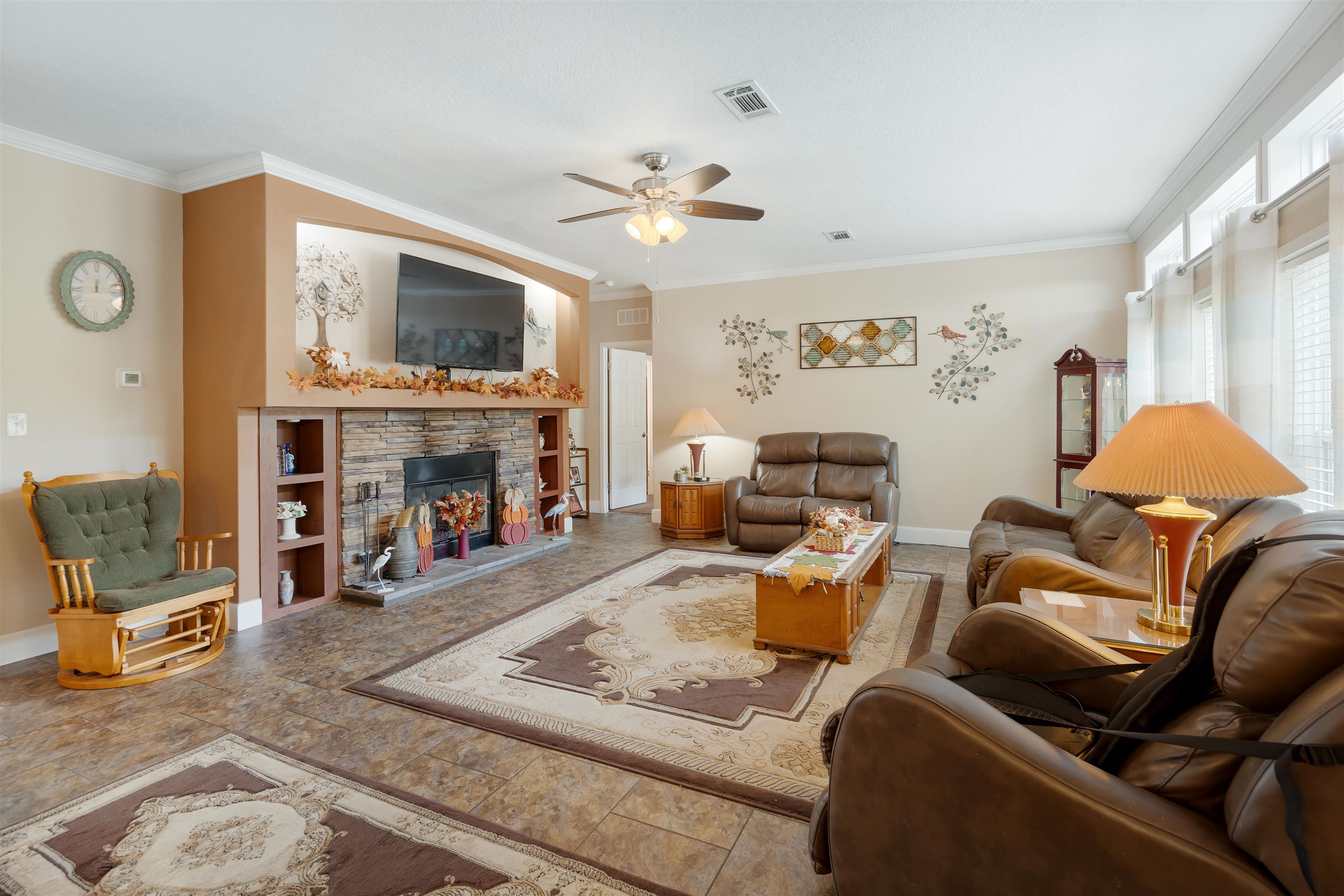 3000 Lightsey Road St. Augustine, FL 32084 - Photo 5 of 35 a living room with furniture a flat screen tv and a fireplace