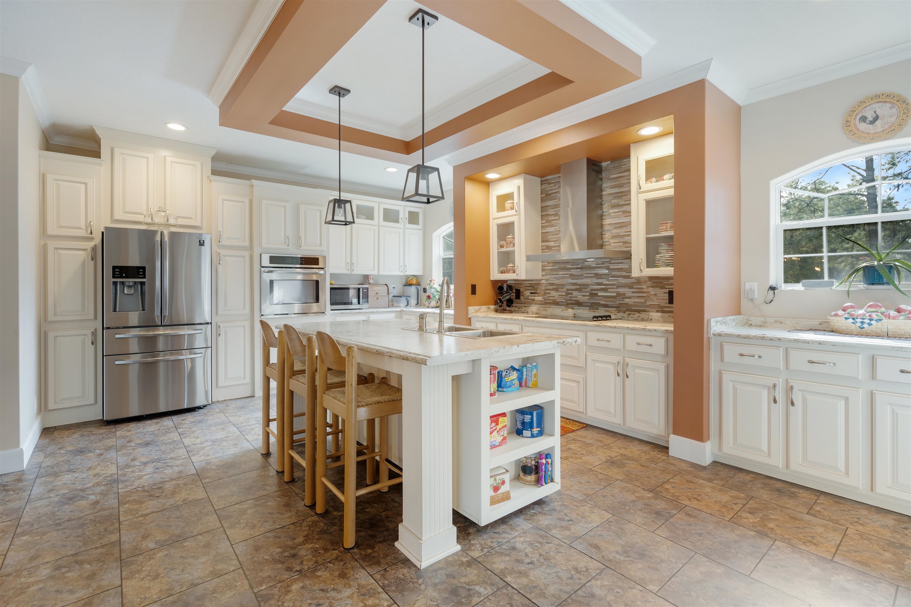 3000 Lightsey Road St. Augustine, FL 32084 - Photo 7 of 35 a kitchen that has a lot of white cabinets and stainless steel appliances