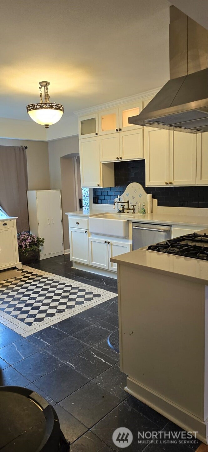 237 C Street Southwest Castle Rock, WA 98611 - Photo 16 of 33 a kitchen with a sink appliances and cabinets