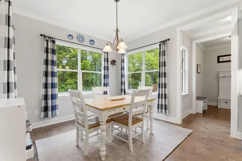 a dining room with furniture window wooden floor