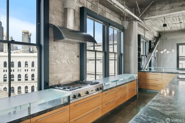 a bathroom with a sink and mirror with toilet