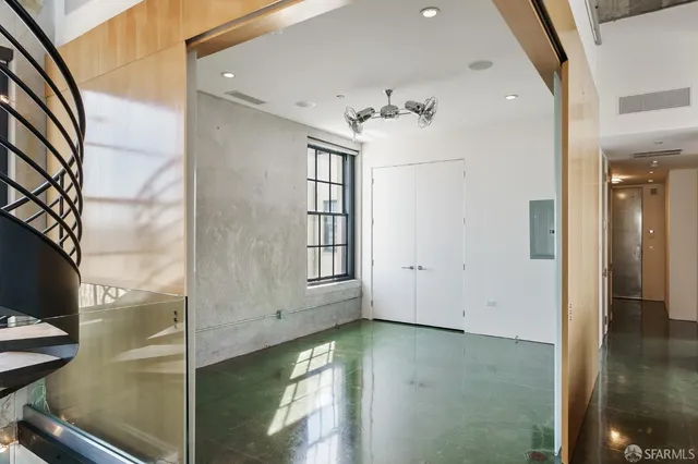 a view of terrace with lawn chairs and iron fence