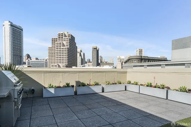 an empty room with windows and ceiling fan