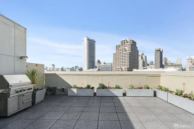 an empty room with wooden floor and a hallway