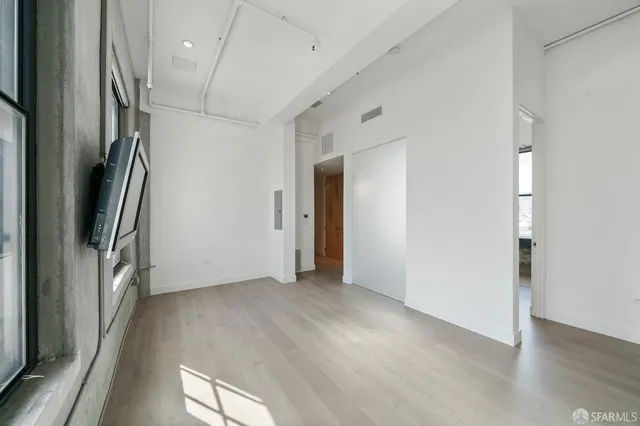 a view of a hallway with washer and dryer