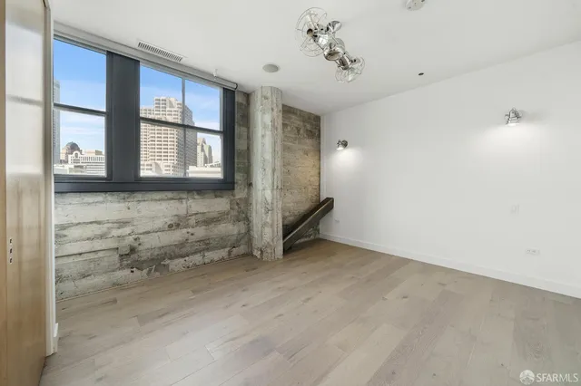 a view of staircase with white walls and windows