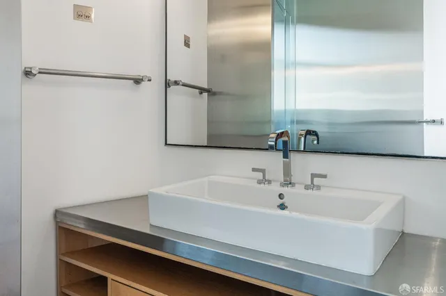 a large spacious bathroom with a tub and shower