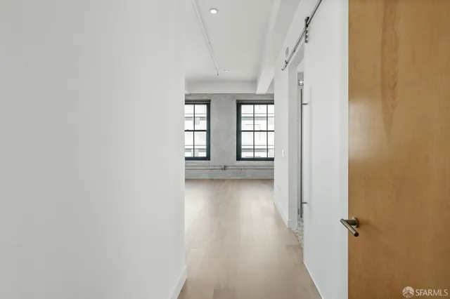 a bathroom with a granite countertop sink a toilet and a shower