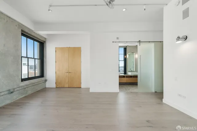 a close view of light fixtures and a mirror of a bathroom