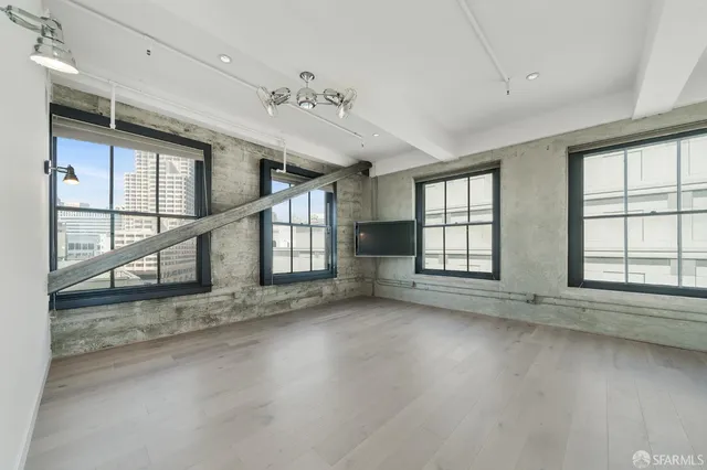 a kitchen with a stove a sink and a window