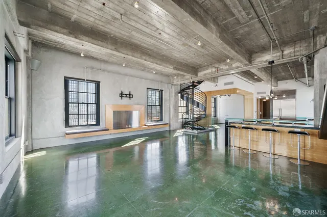 a view of a living room with a large window