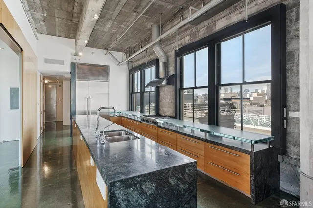 a view of living room with furniture and large window