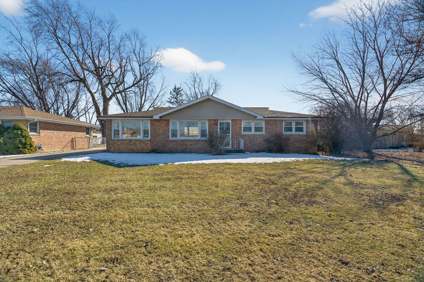 7929 74th Street Bridgeview, IL 60455 - Photo 1 of 1 a front view of a house with a yard and large trees
