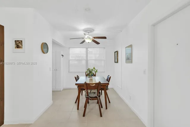 a kitchen with white cabinets sink and white appliances