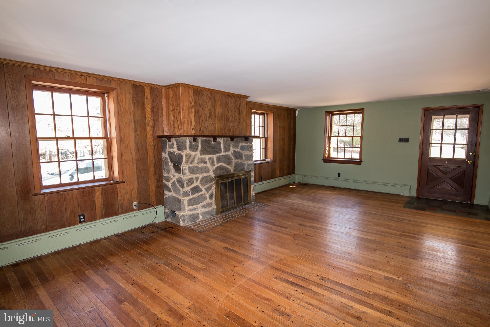 139 Mattson Road Garnet Valley, PA 19060 - Photo 4 of 39 Living Room with Stone, Wood Burning Fireplace