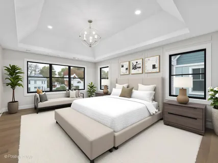 a spacious bedroom with a large bed and a couch