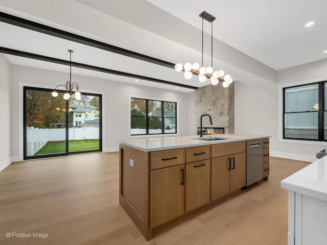 a spacious bathroom with a sink and large mirror