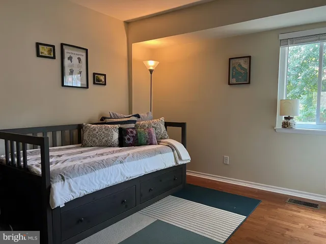 a bed room with a bed and a window