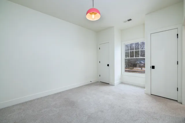 an empty room with a mirror