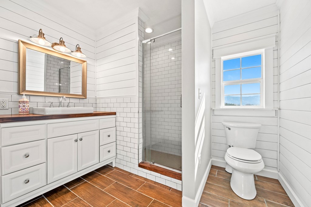2040 Maples Branch Road Sevierville, TN 37876 - Photo 24 of 40 a bathroom with a toilet sink and shower