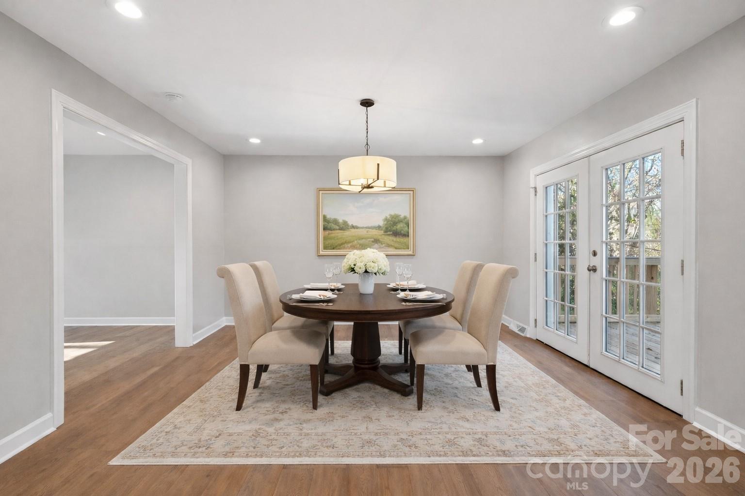 1216 Old Farm Road Charlotte, NC 28226 - Photo 11 of 36 a dining room with furniture window and wooden floor