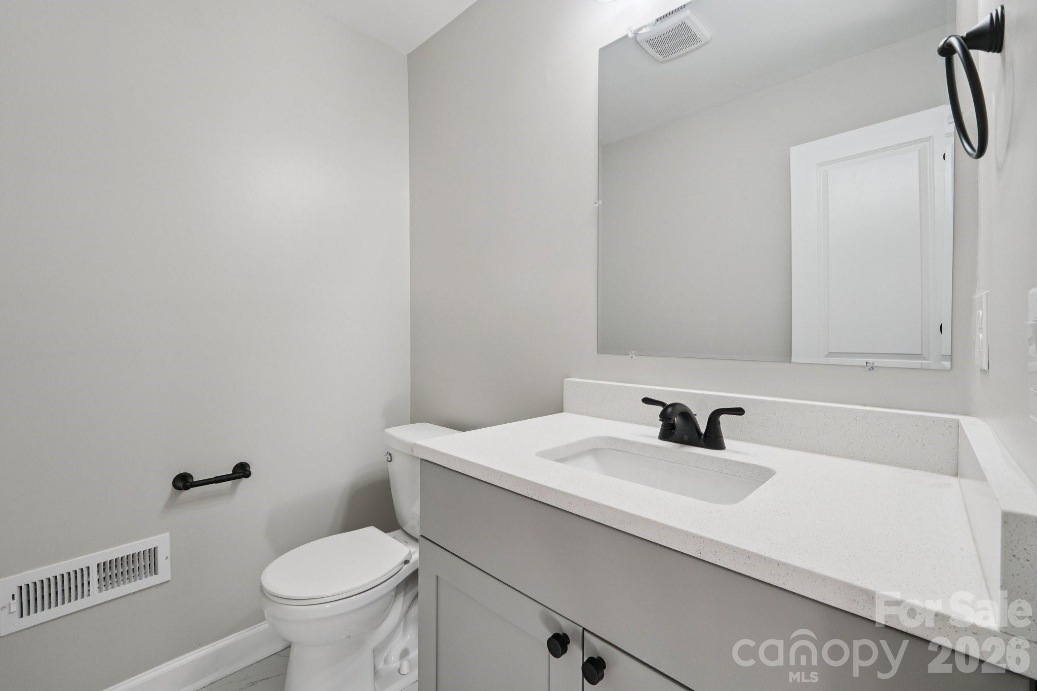 1216 Old Farm Road Charlotte, NC 28226 - Photo 15 of 36 a bathroom with a sink toilet and mirror