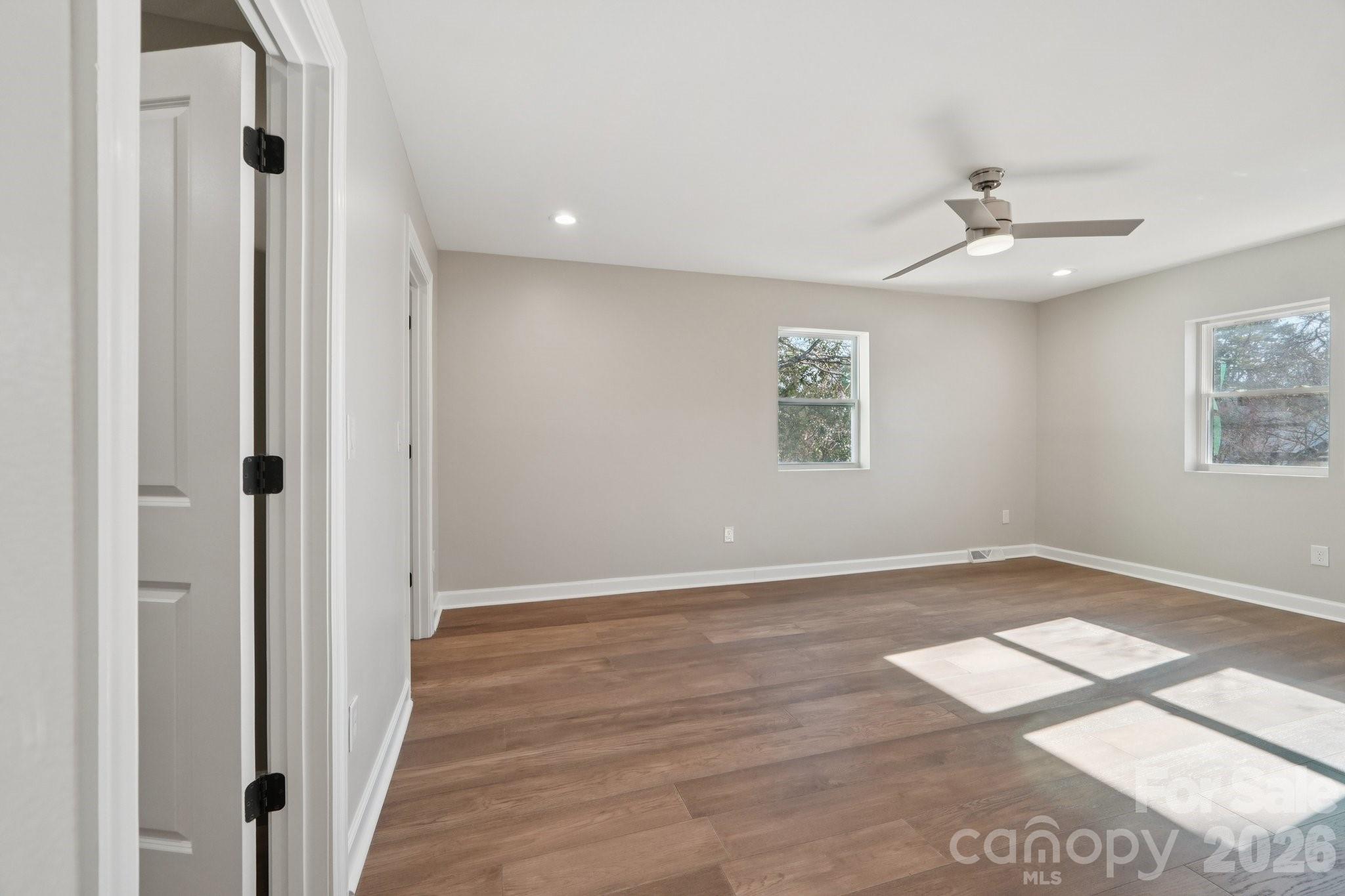 1216 Old Farm Road Charlotte, NC 28226 - Photo 17 of 36 wooden floor in an empty room with a window