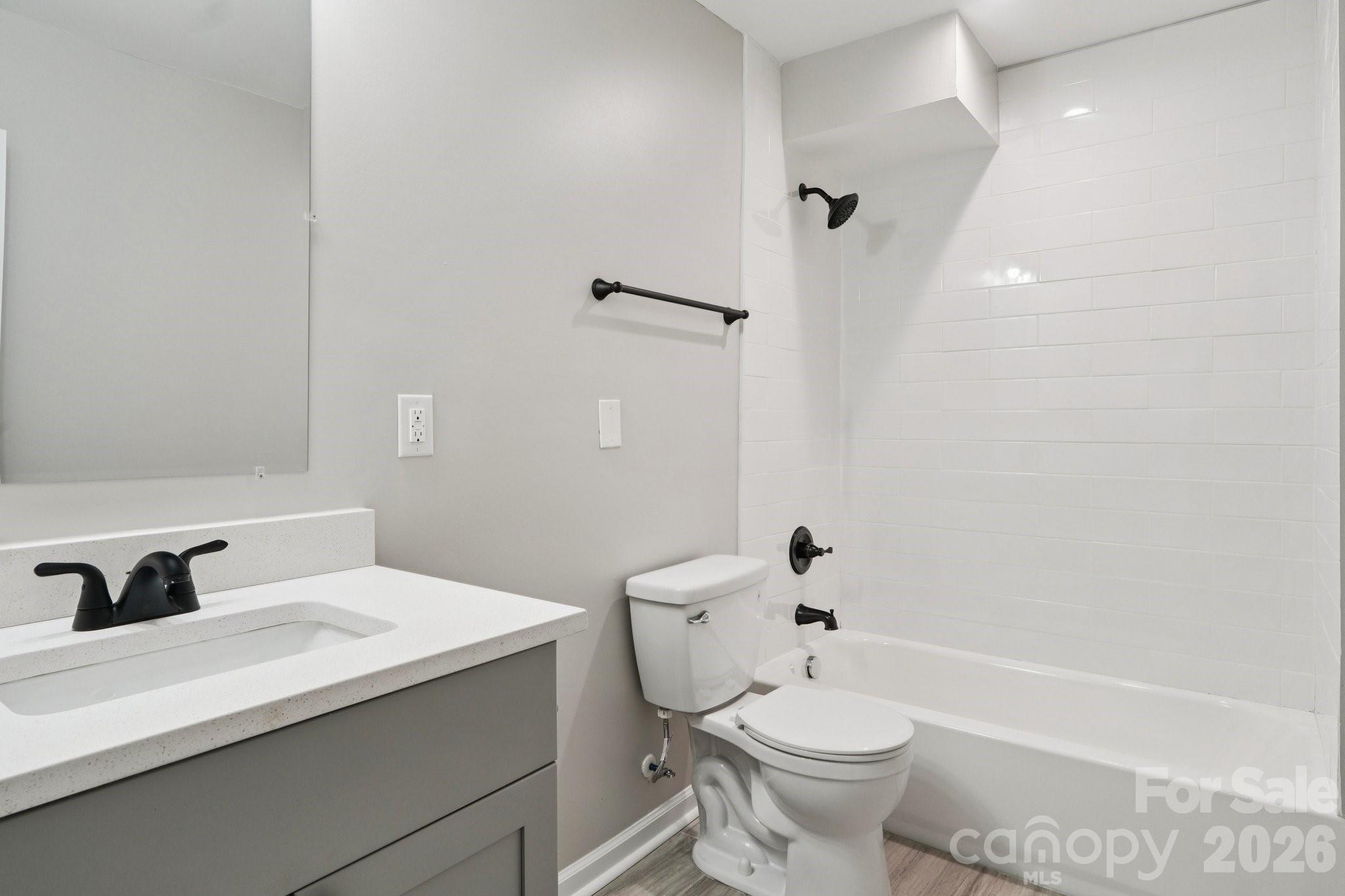 1216 Old Farm Road Charlotte, NC 28226 - Photo 27 of 36 a bathroom with a sink a toilet and shower