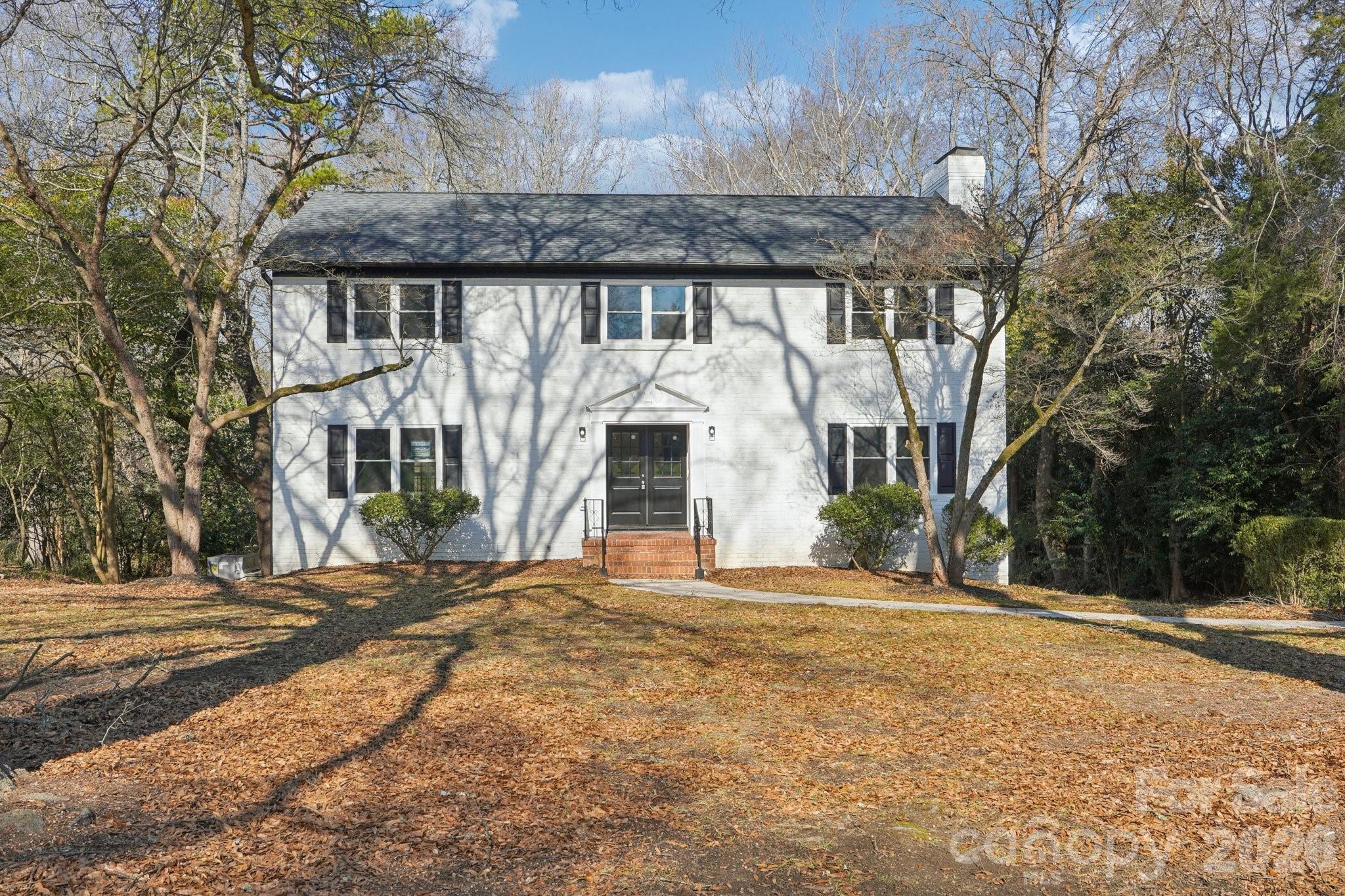1216 Old Farm Road Charlotte, NC 28226 - Photo 33 of 36 a front view of a house with a yard