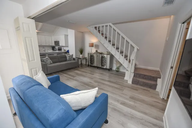 a living room with furniture and a rug