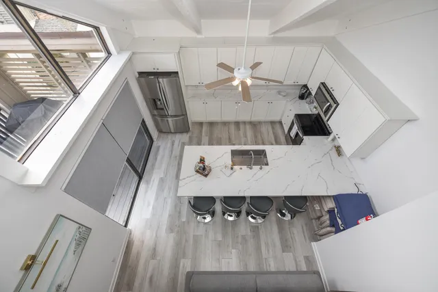 a view of kitchen and dining room with wooden floor