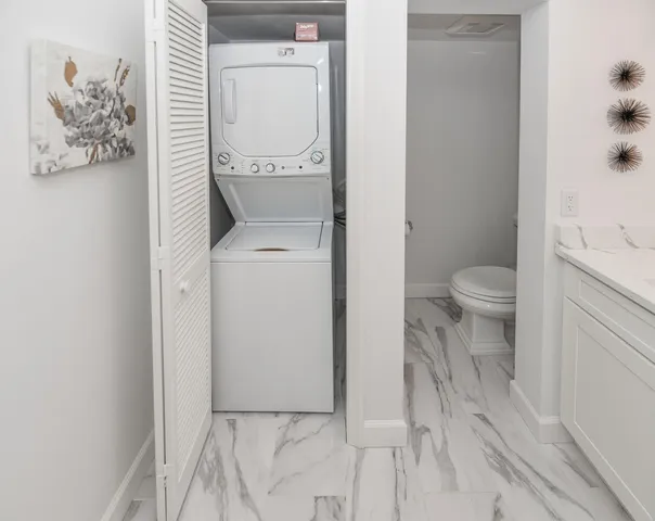 a bathroom with a toilet and a vanity