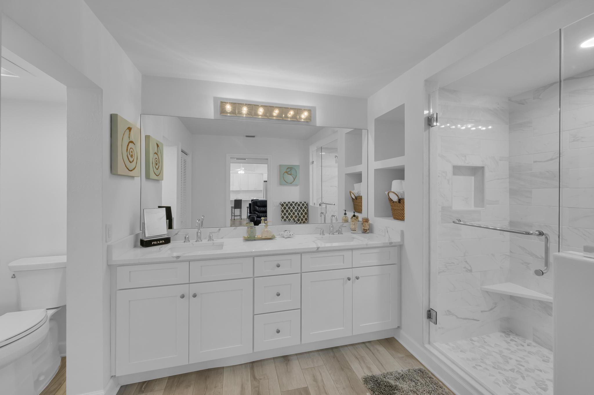 1605 Highway 1, Unit SL3G Jupiter, FL 33477 - Photo 31 of 54 a bathroom with a sink a toilet and shower