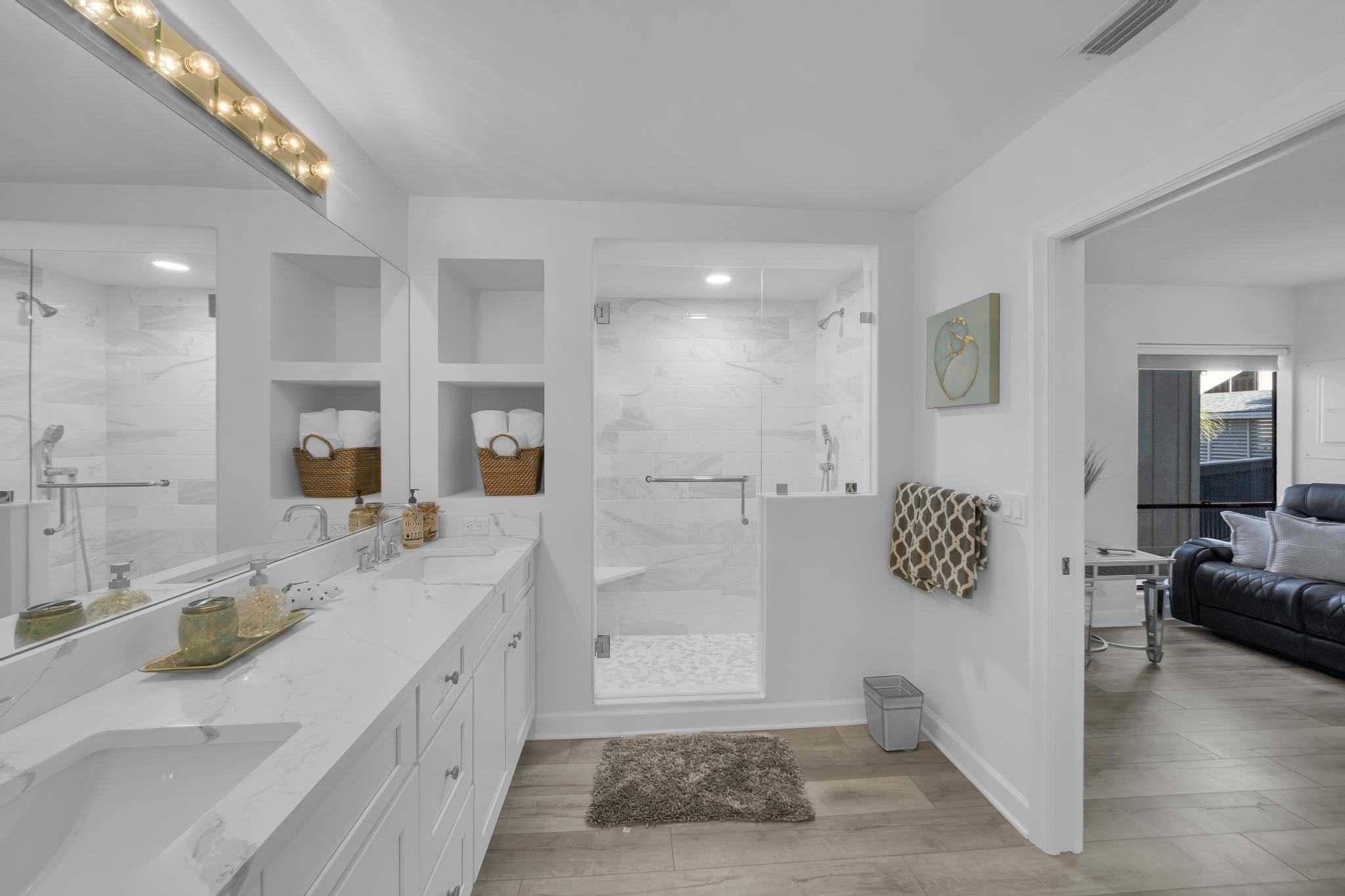 1605 Highway 1, Unit SL3G Jupiter, FL 33477 - Photo 32 of 54 a spacious bathroom with a granite countertop sink mirror and vanity