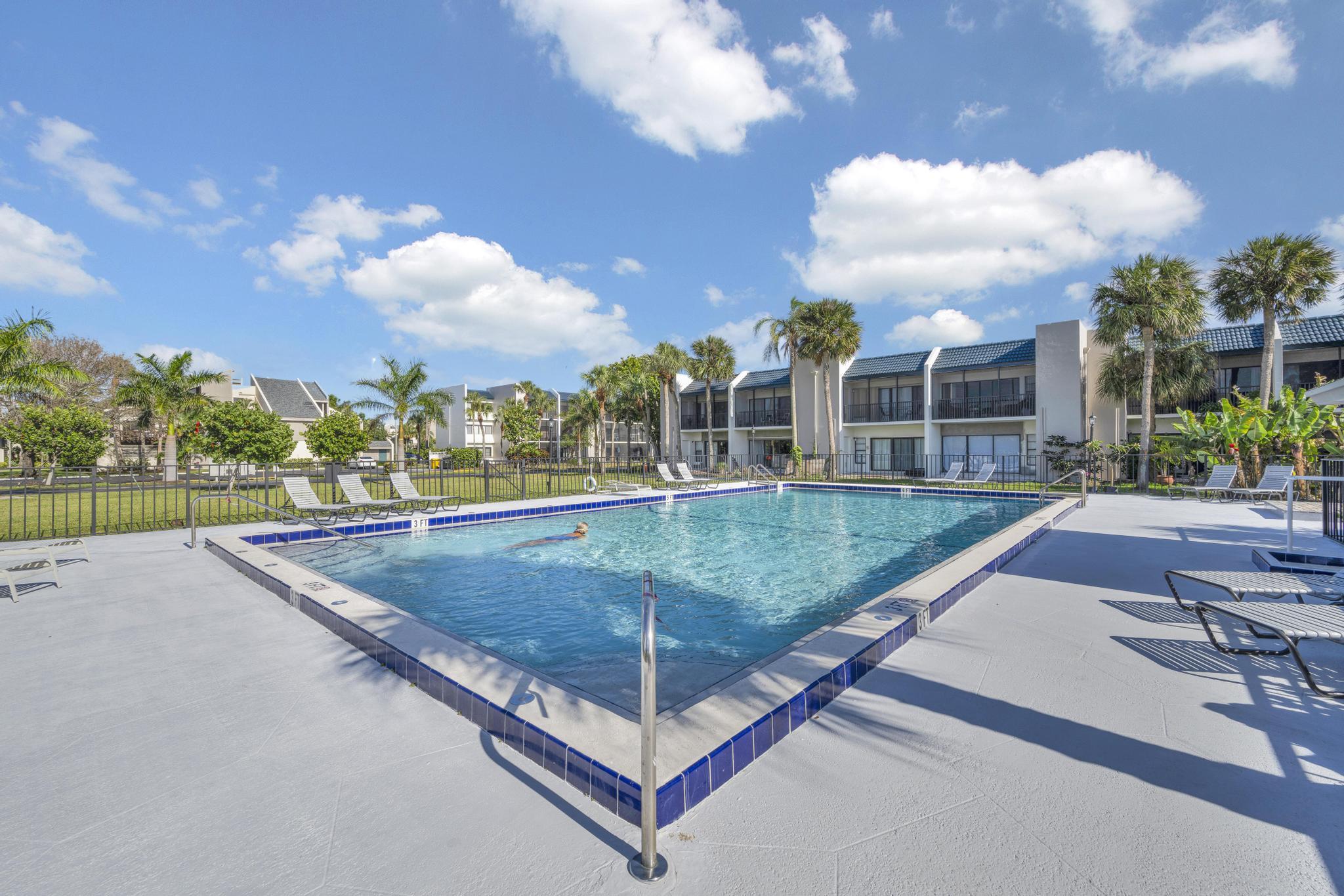 1605 Highway 1, Unit SL3G Jupiter, FL 33477 - Photo 39 of 54 a view of a swimming pool with a patio