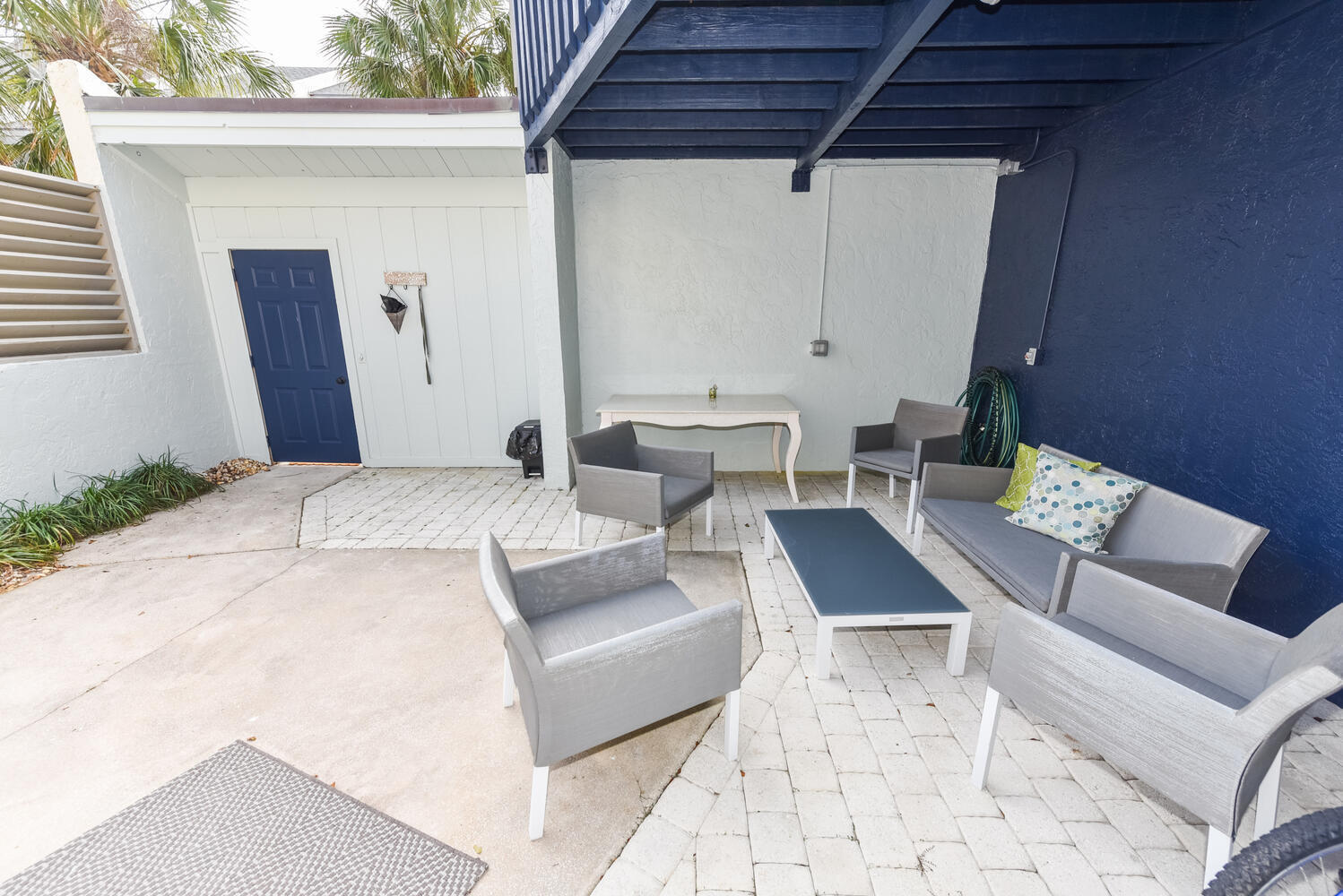 1605 Highway 1, Unit SL3G Jupiter, FL 33477 - Photo 6 of 54 a building outdoor space with patio furniture and potted plants