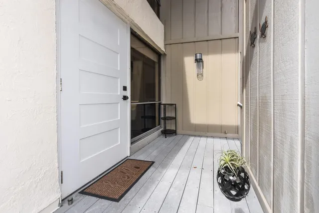 a view of walk in closet with wooden floor
